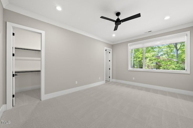 unfurnished bedroom featuring light colored carpet, visible vents, recessed lighting, and baseboards