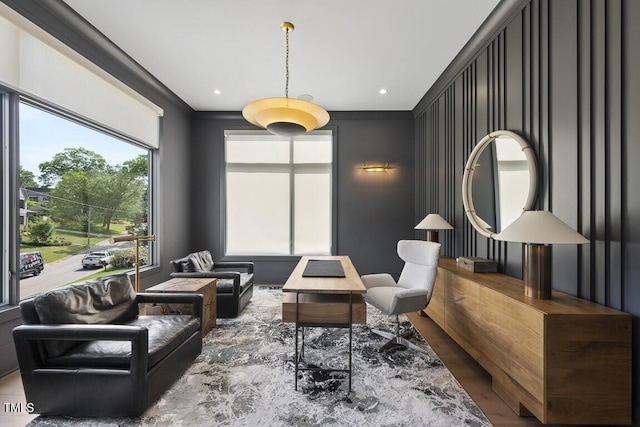 living area with wood finished floors and recessed lighting