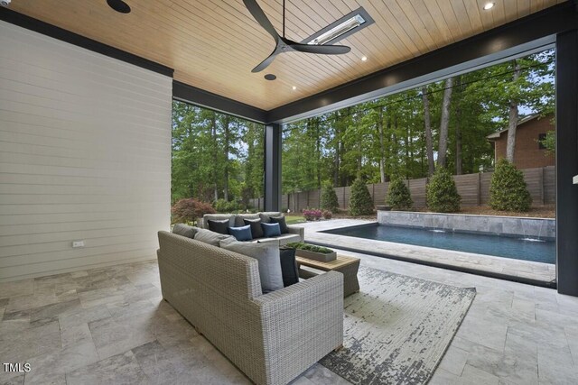 view of patio featuring a fenced in pool, ceiling fan, and a fenced backyard
