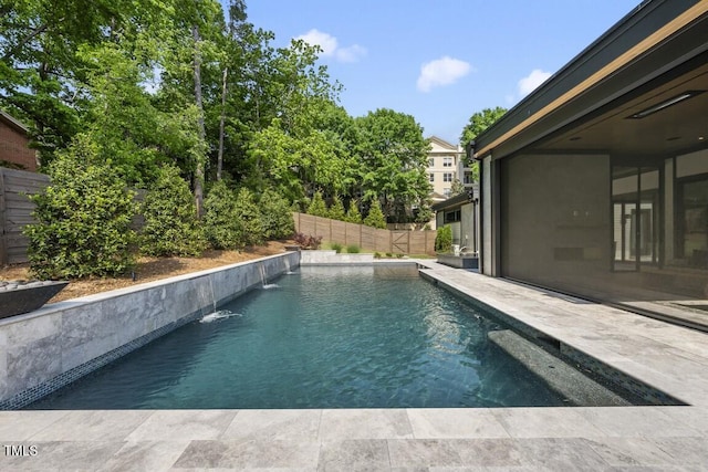 pool featuring a fenced backyard