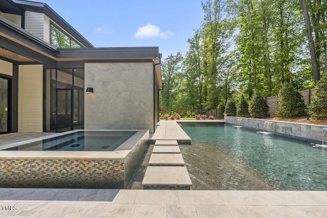 outdoor pool with an in ground hot tub