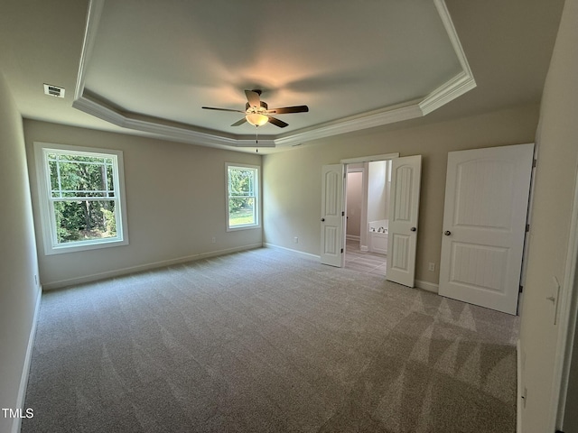 93 Hot Springs Way, Benson, NC 27504 - unfurnished bedroom featuring a raised ceiling, carpet flooring, ornamental molding, connected bathroom, and a ceiling fan