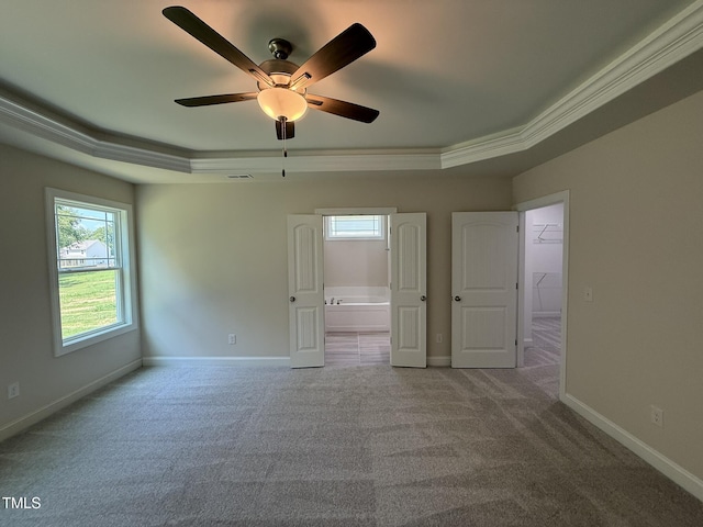 93 Hot Springs Way, Benson, NC 27504 - carpeted empty room with a raised ceiling, healthy amount of natural light, a ceiling fan, and crown molding