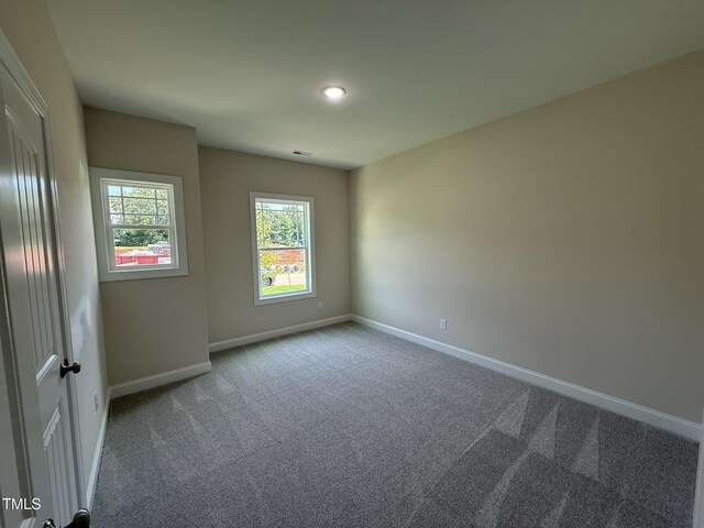 93 Hot Springs Way, Benson, NC 27504 - carpeted empty room with baseboards and recessed lighting