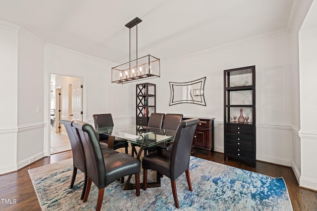 2000 Katesbridge Ln, Raleigh, NC 27614 - dining space with ornamental molding, dark wood-style floors, and a chandelier