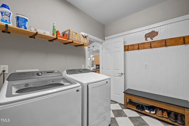 washroom featuring separate washer and dryer and laundry area