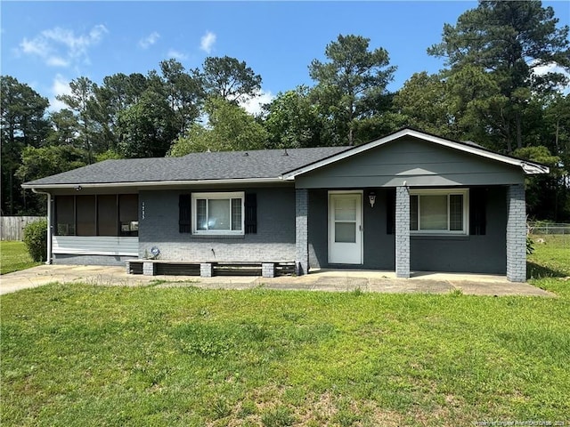 1725 Sand Hill Rd, Hope Mills, NC 28348 - single story home with a porch, fence, a shingled roof, and a front lawn