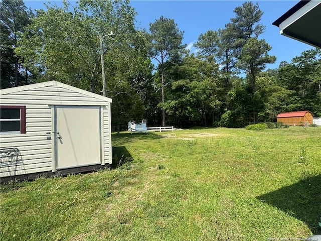 1725 Sand Hill Rd, Hope Mills, NC 28348 - view of yard with a storage shed and an outdoor structure