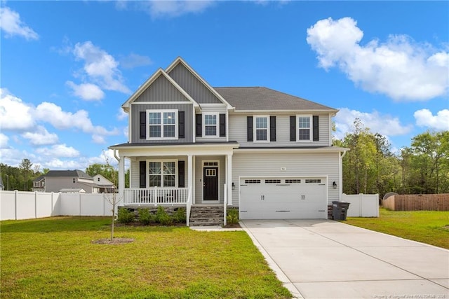 view of front of house with driveway, a porch, fence, an attached garage, and board and batten siding