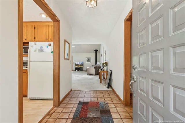 1619 Stonegate N, Sanford, NC 27332 - hall with baseboards, light carpet, and light tile patterned floors