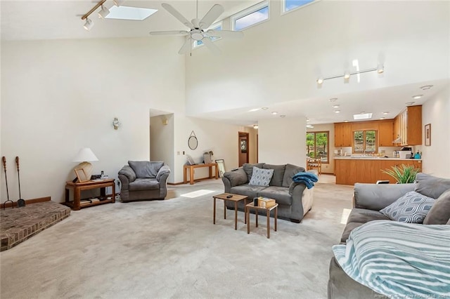 1619 Stonegate N, Sanford, NC 27332 - living room with light carpet, a high ceiling, rail lighting, and ceiling fan