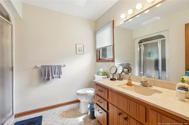 1619 Stonegate N, Sanford, NC 27332 - full bath featuring baseboards, toilet, vanity, and a stall shower
