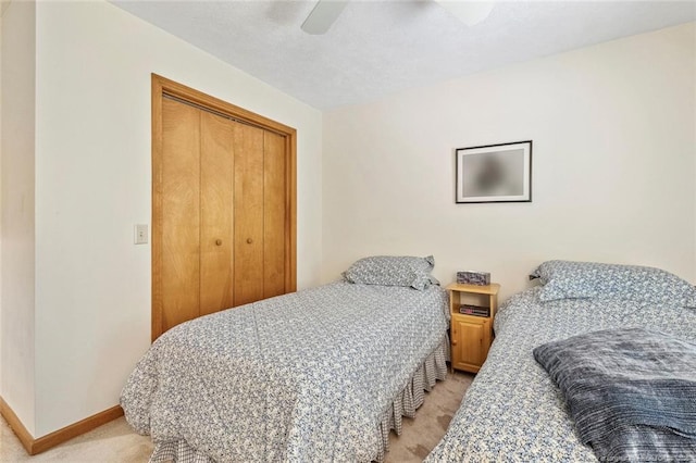 1619 Stonegate N, Sanford, NC 27332 - bedroom with baseboards, a closet, a ceiling fan, and light colored carpet