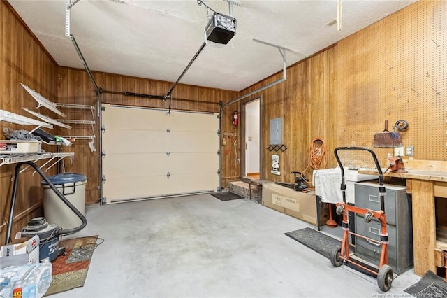 1619 Stonegate N, Sanford, NC 27332 - garage with wooden walls, electric panel, and a garage door opener
