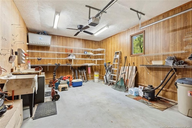 1619 Stonegate N, Sanford, NC 27332 - interior space with ceiling fan, a garage door opener, and wooden walls