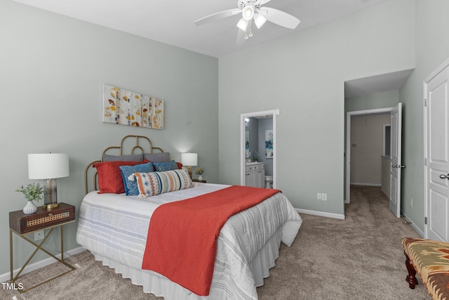 bedroom with carpet, baseboards, connected bathroom, and a ceiling fan