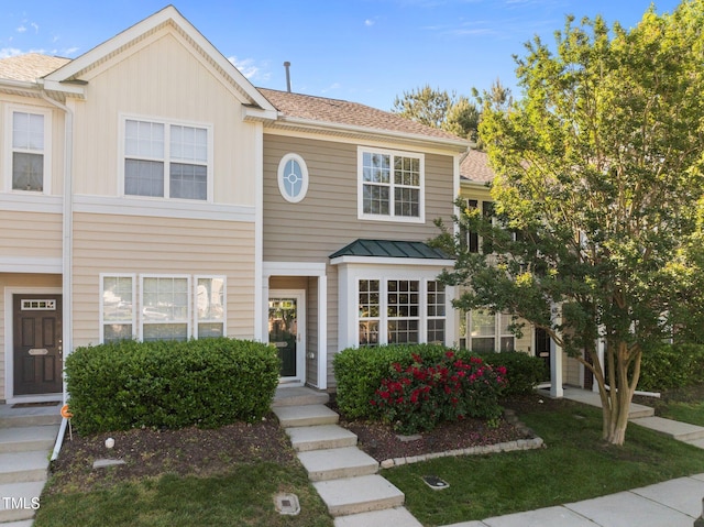 townhome / multi-family property featuring a standing seam roof