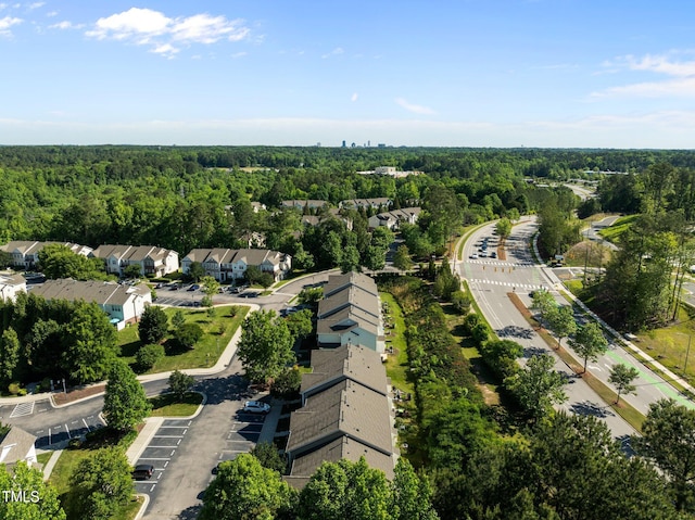 aerial overview of property's location with a forest