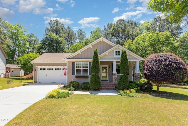 71 Potted Plant Ct, Clayton, NC 27520 - craftsman house with an attached garage, a front lawn, driveway, and a porch