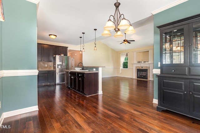 71 Potted Plant Ct, Clayton, NC 27520 - kitchen with dark wood-style flooring, stainless steel refrigerator with ice dispenser, ceiling fan with notable chandelier, and dark brown cabinets