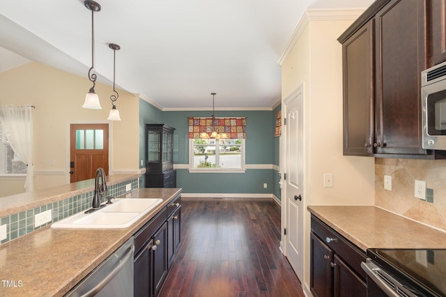71 Potted Plant Ct, Clayton, NC 27520 - kitchen featuring dark brown cabinets, pendant lighting, decorative backsplash, and a sink