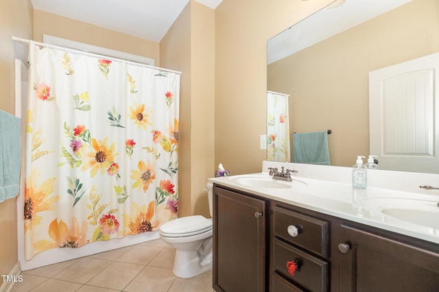 71 Potted Plant Ct, Clayton, NC 27520 - bathroom with a sink, tile patterned floors, toilet, and double vanity