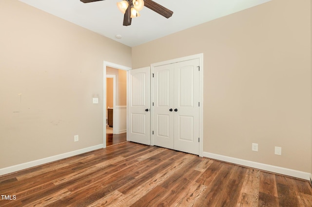 71 Potted Plant Ct, Clayton, NC 27520 - unfurnished bedroom with baseboards, a ceiling fan, wood finished floors, and a closet