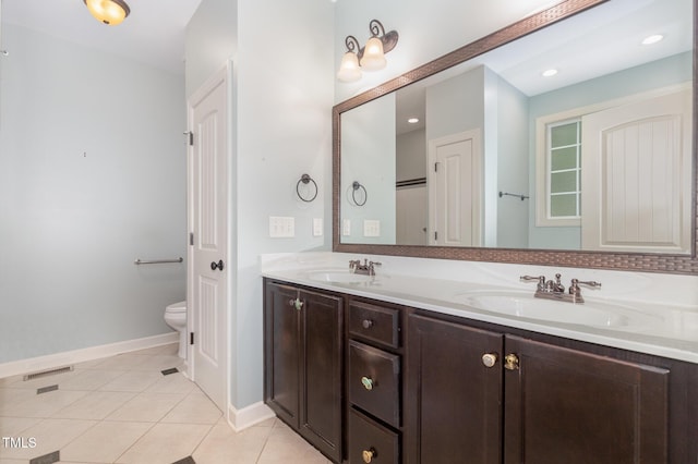 71 Potted Plant Ct, Clayton, NC 27520 - full bath with double vanity, tile patterned floors, visible vents, and a sink