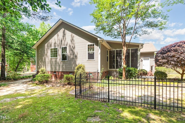 71 Potted Plant Ct, Clayton, NC 27520 - view of front of house with a sunroom, fence private yard, a front lawn, and crawl space