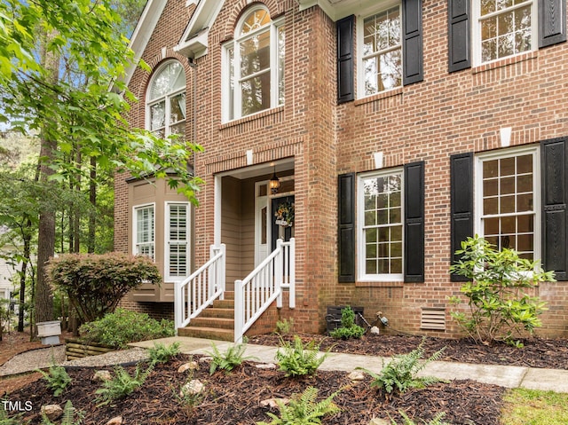view of front of house with brick siding