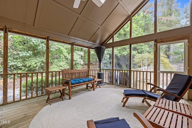 sunroom / solarium featuring ceiling fan and lofted ceiling