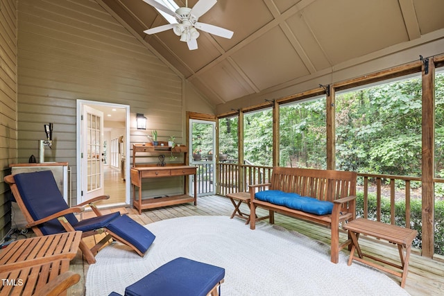 sunroom featuring ceiling fan and lofted ceiling