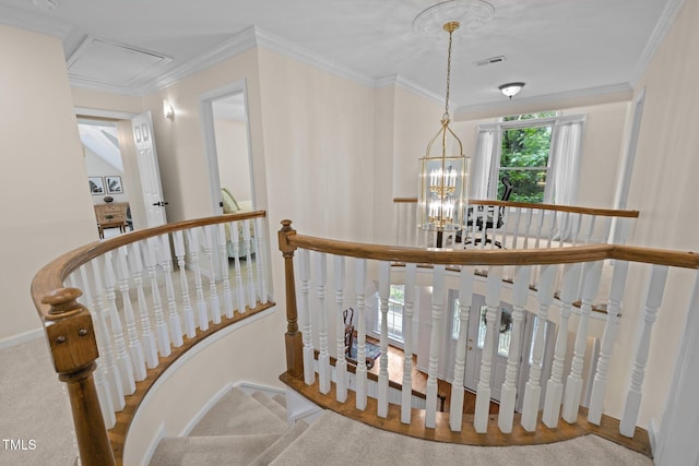 stairway with a chandelier, ornamental molding, and baseboards