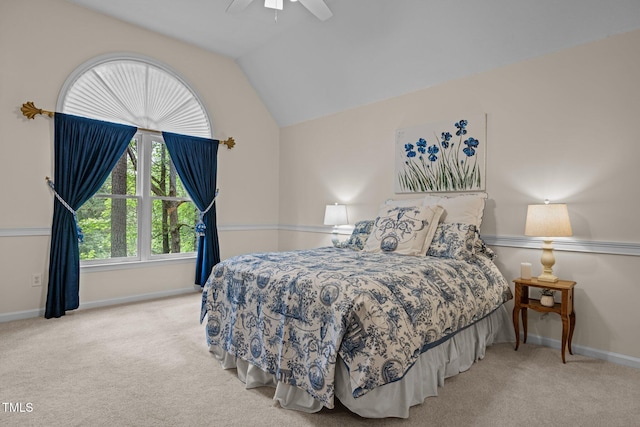 bedroom featuring carpet floors, baseboards, and lofted ceiling