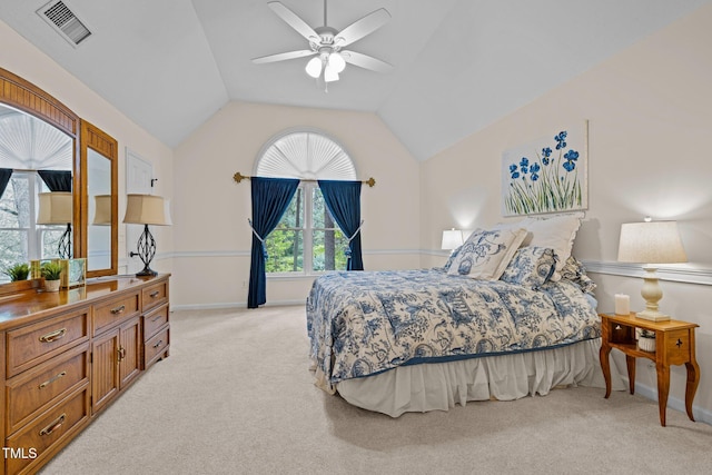 bedroom featuring light carpet, baseboards, and vaulted ceiling