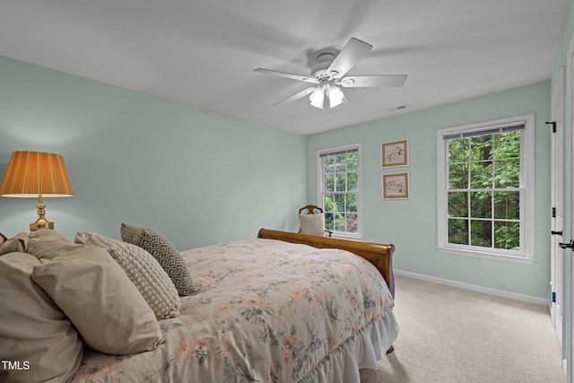 bedroom featuring baseboards, carpet, and a ceiling fan