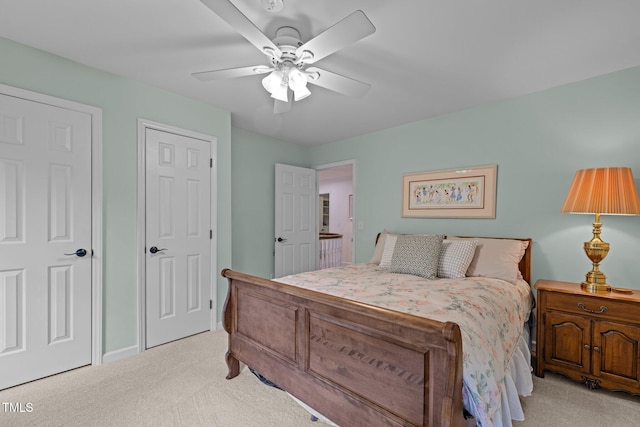 bedroom with carpet floors, a ceiling fan, and baseboards