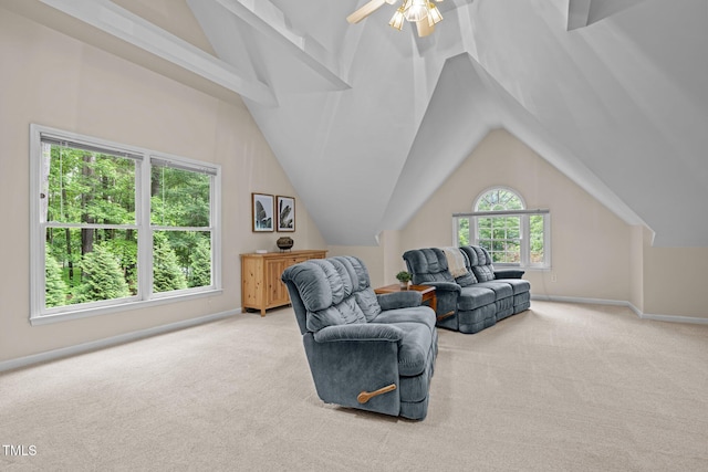 sitting room featuring light colored carpet, baseboards, a ceiling fan, and lofted ceiling