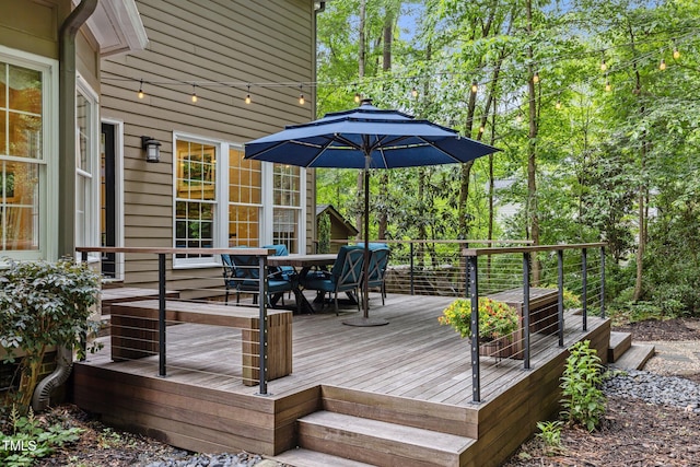 wooden deck with outdoor dining area