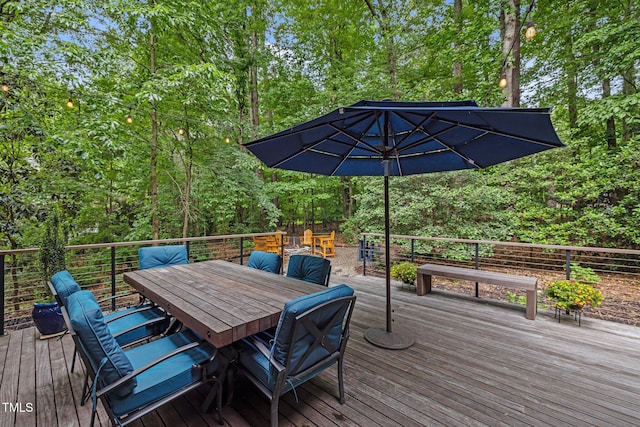 wooden terrace featuring outdoor dining area