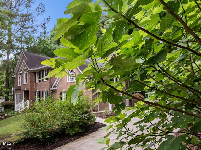 view of property exterior with brick siding
