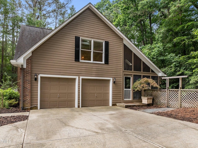view of front of property featuring driveway and a garage
