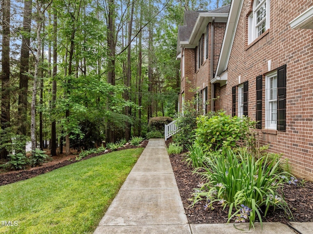 view of home's community with a lawn