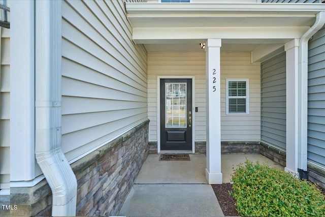 225 Gulley Glen Dr, Garner, NC 27529 - view of exterior entry with a porch