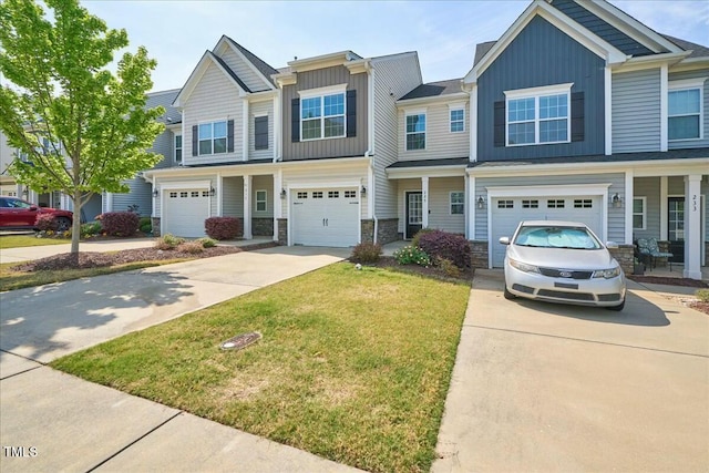 225 Gulley Glen Dr, Garner, NC 27529 - view of property featuring driveway, board and batten siding, a front lawn, and stone siding