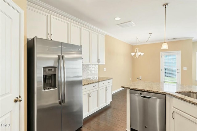 225 Gulley Glen Dr, Garner, NC 27529 - kitchen featuring decorative backsplash, appliances with stainless steel finishes, visible vents, a chandelier, and dark wood-style flooring