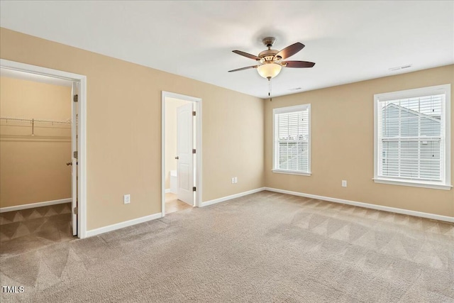 225 Gulley Glen Dr, Garner, NC 27529 - unfurnished bedroom with visible vents, a spacious closet, carpet flooring, and baseboards