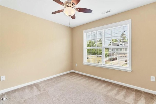 225 Gulley Glen Dr, Garner, NC 27529 - unfurnished room featuring visible vents, ceiling fan, light carpet, and baseboards