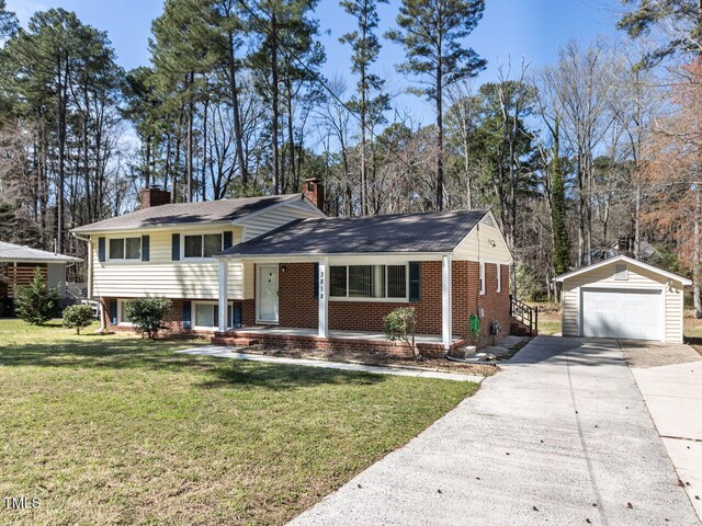 3818 Hillgrand Dr, Durham, NC 27705 - tri-level home featuring a chimney, concrete driveway, an outbuilding, brick siding, and a garage