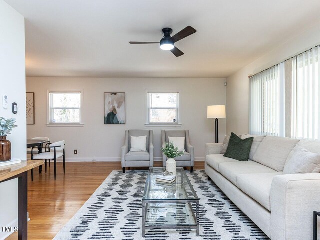 3818 Hillgrand Dr, Durham, NC 27705 - living area with wood finished floors, a ceiling fan, and baseboards